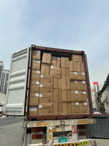 Full container of laser toner cartridges arriving at Sham Tech Dubai warehouse — wholesale supply at scale. Live real image